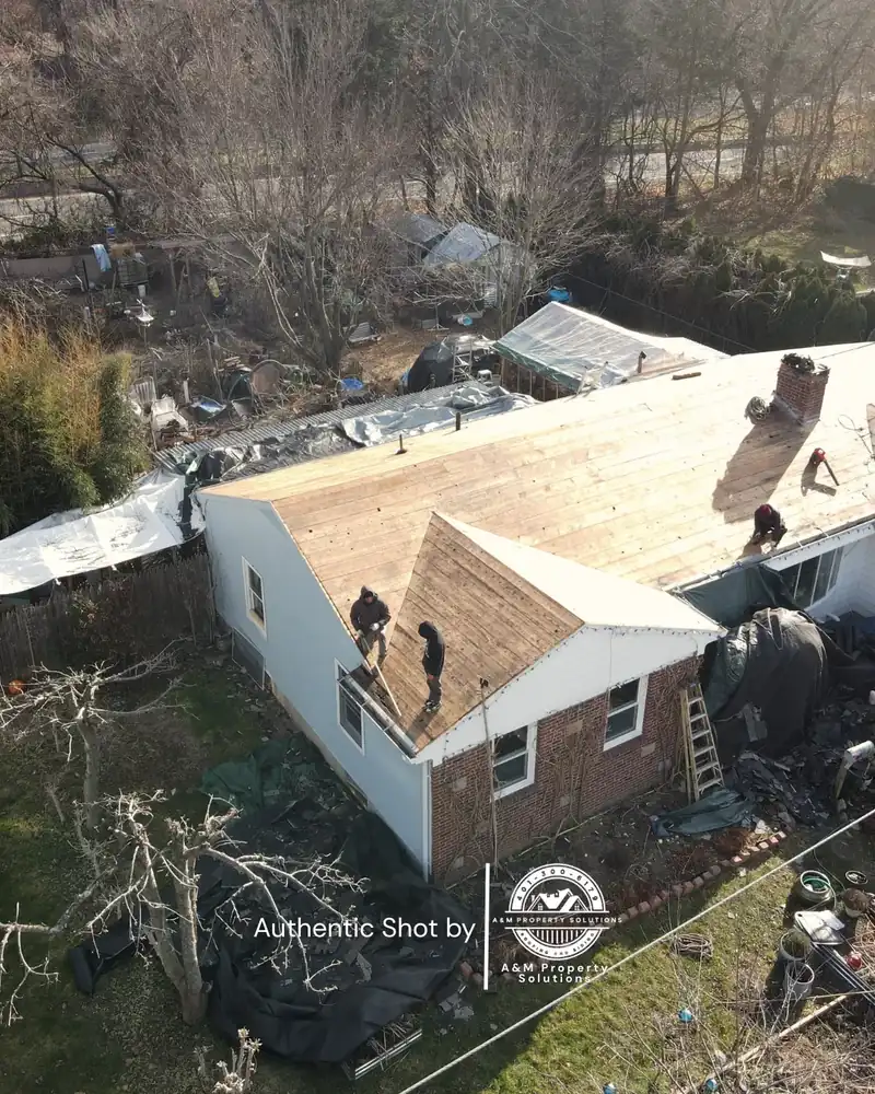 Roof deck exposed during a storm damage tear-off, documented by A&M Property Solutions for an insurance claim.
